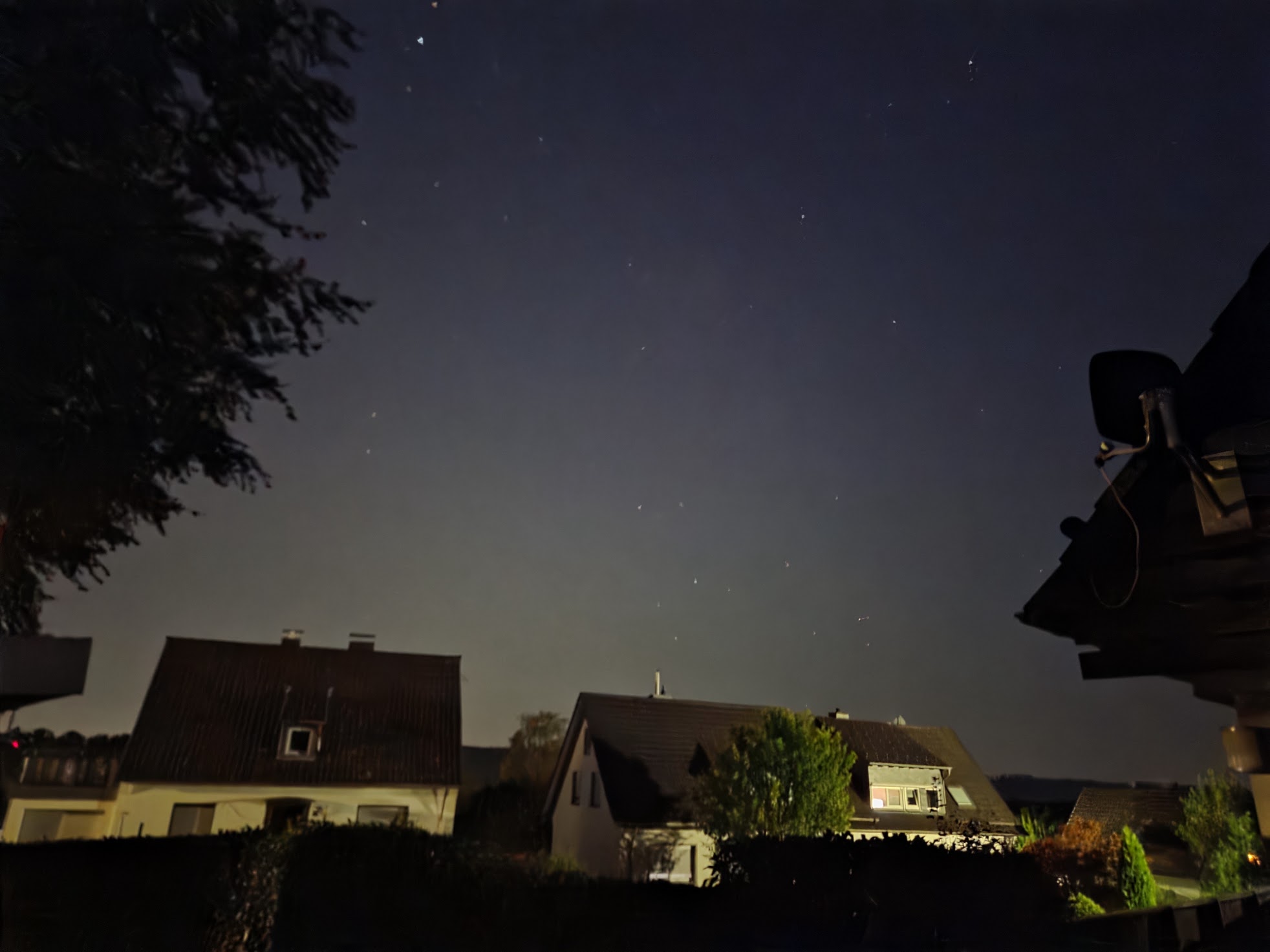 Visible light pollution on the horizon from city lights reducing the visibility of the milky way.